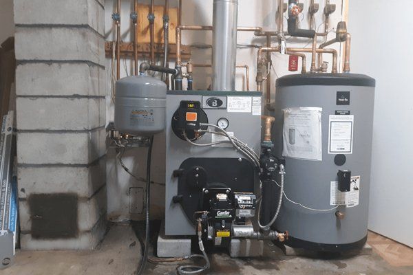 Modern Buderus boiler and Heat-Flo water heater installation by Gottier Fuel